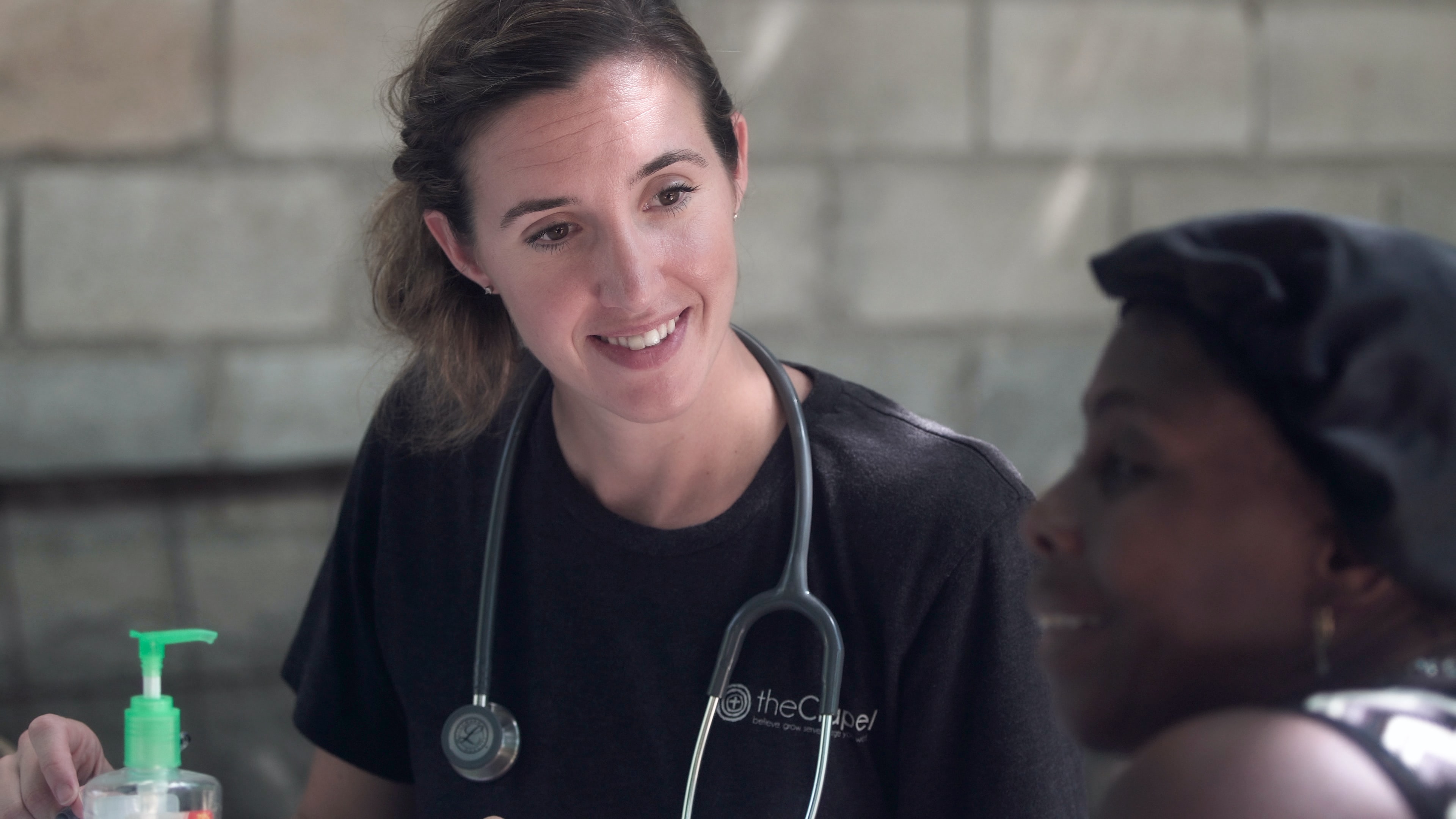 Primary health professional supporting a community patient